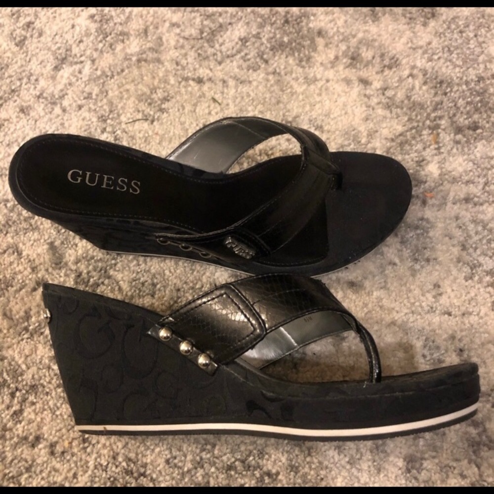 Guess women’s monogram wedge thong heel sandals.  Excellent condition.